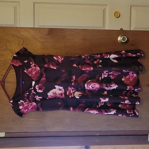 A maroon colored dress with floral design